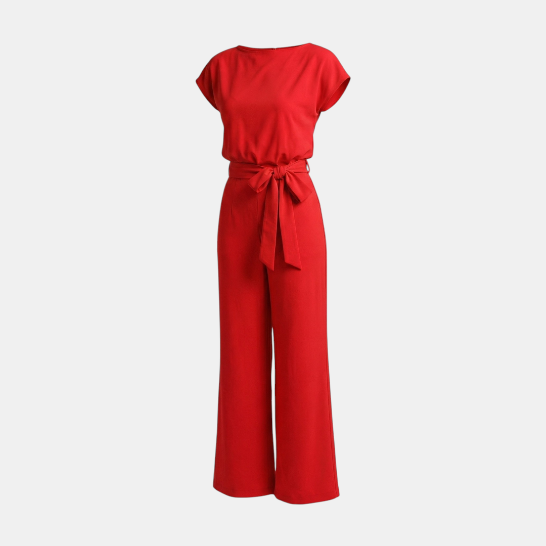 Front view of the Paloma Jumpsuit Wide-Leg Tie-Waist in red, featuring a round neckline, cap sleeves, self-tie waist belt, and an elegant flowing wide-leg design. Designed by Bella Hudson.