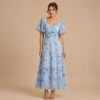 Patrice Floral Chiffon Maxi Dress with flutter sleeves in light blue front view. Designed by Bella Hudson.