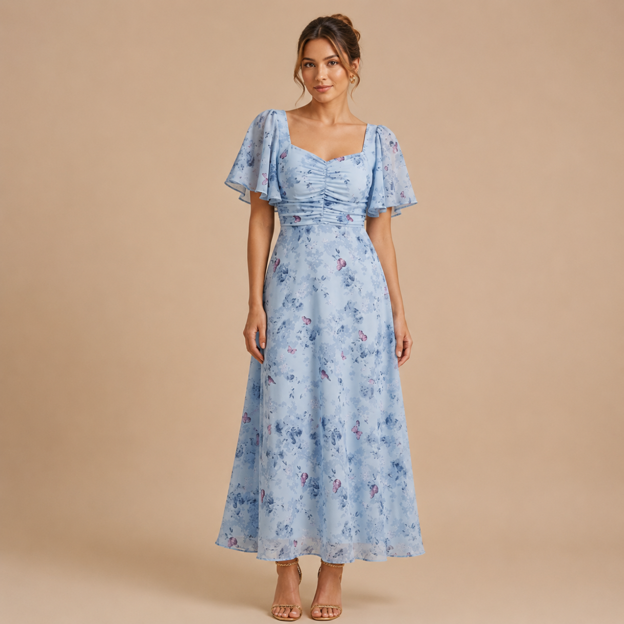 Patrice Floral Chiffon Maxi Dress with flutter sleeves in light blue front view. Designed by Bella Hudson.