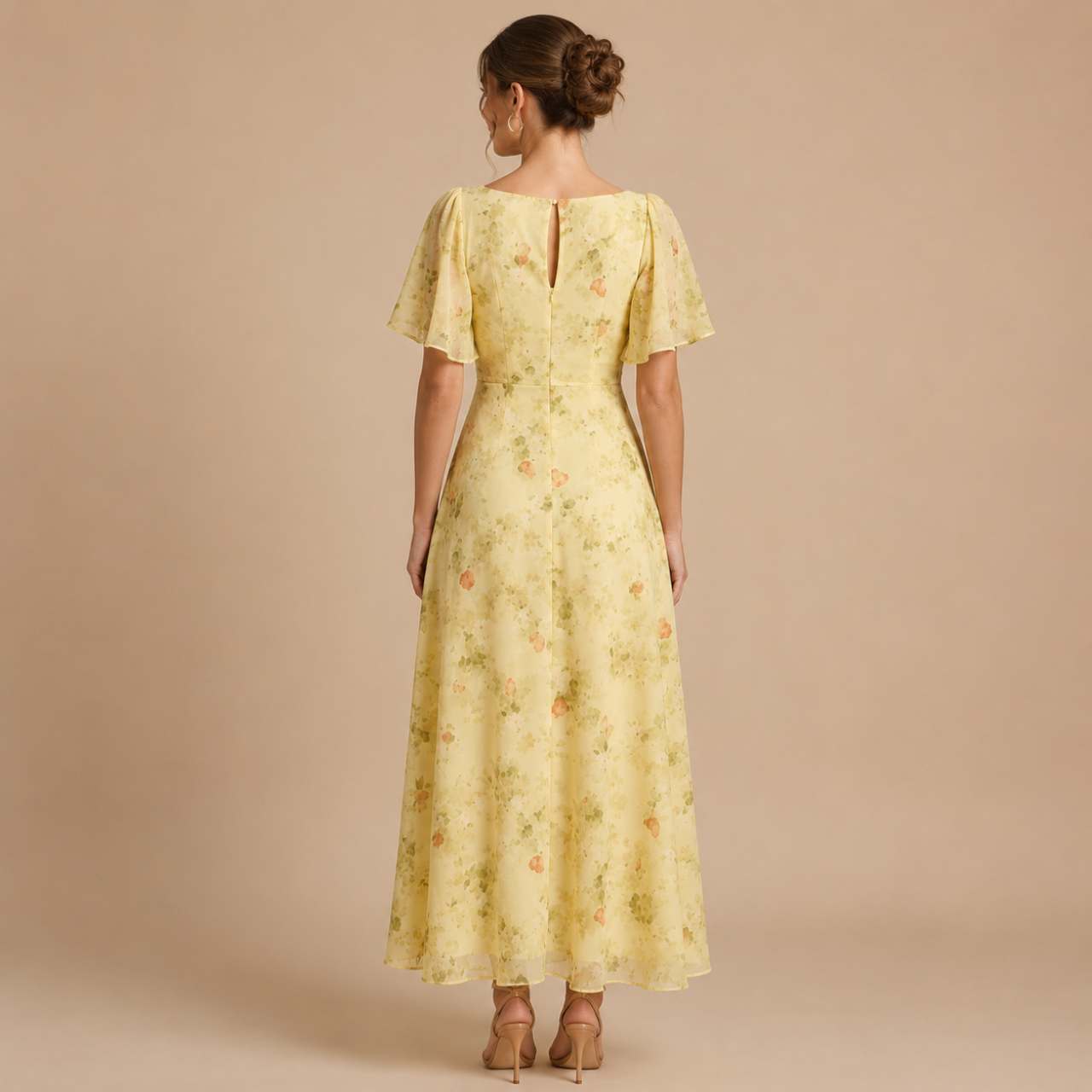Back view of the Patrice Floral Chiffon Maxi Dress with flutter sleeves in yellow. Designed by Bella Hudson.