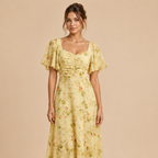 Patrice Floral Chiffon Maxi Dress with flutter sleeves in yellow, shown on model. Designed by Bella Hudson.