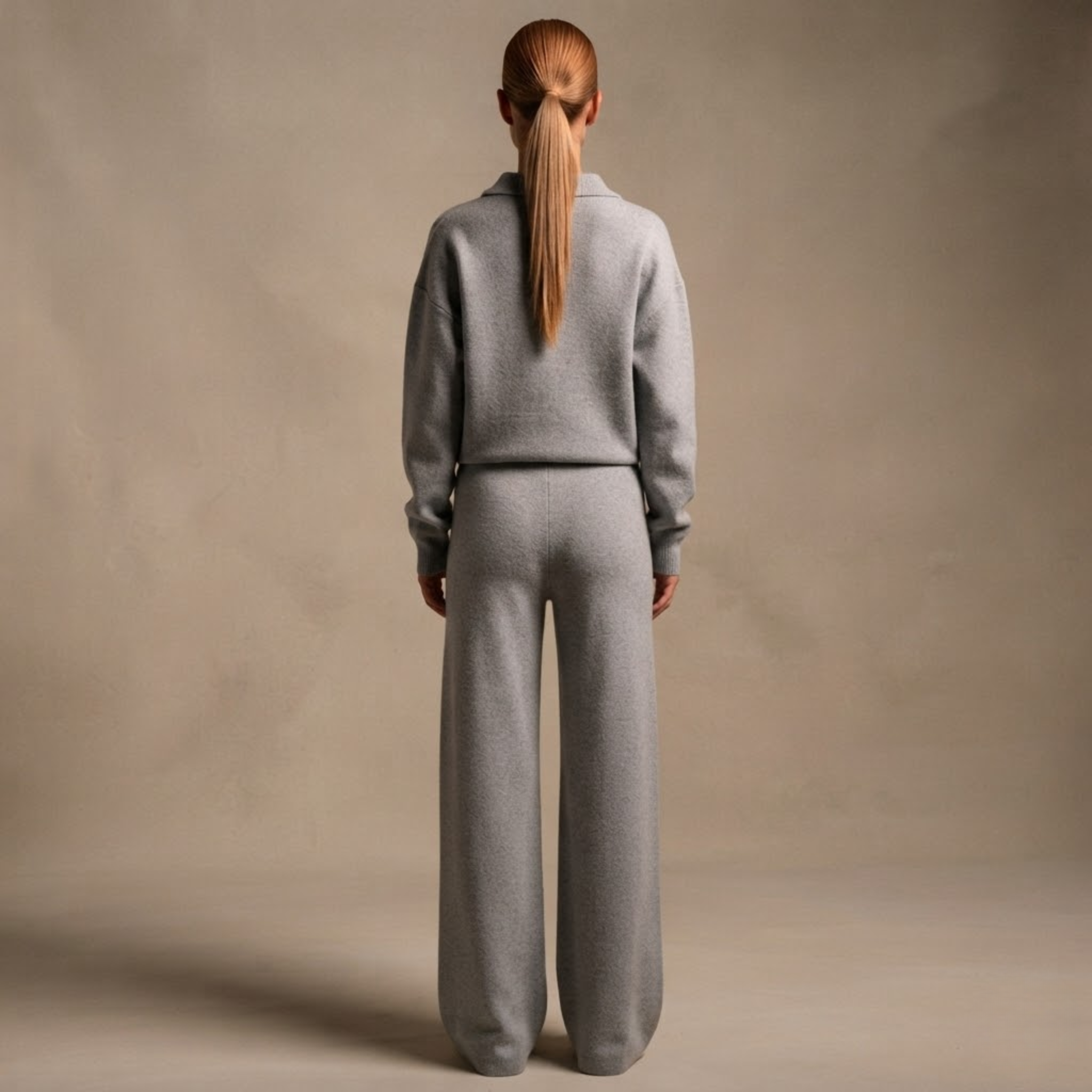 Back view of the Perpetua Two-Piece Set Knit Collared in Grey, highlighting the coordinated knit design and relaxed silhouette. Designed by Bella Hudson.