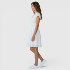 Side view of the Philippa Fit-and-Flare Dress Lace-Trim Puff-Sleeve Striped in white, showcasing the flattering fit-and-flare silhouette, flutter sleeves, and elegant knee-length design. Designed by Bella Hudson.