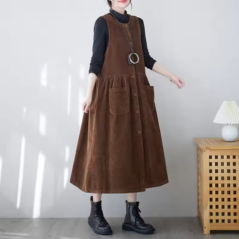 Phoebe Brown corduroy pinafore midi dress with sleeveless A-line shape and front pockets