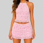 Front view of pink B lace crop top and mini skirt set with smocked texture and scalloped hem by BELLA HUDSON