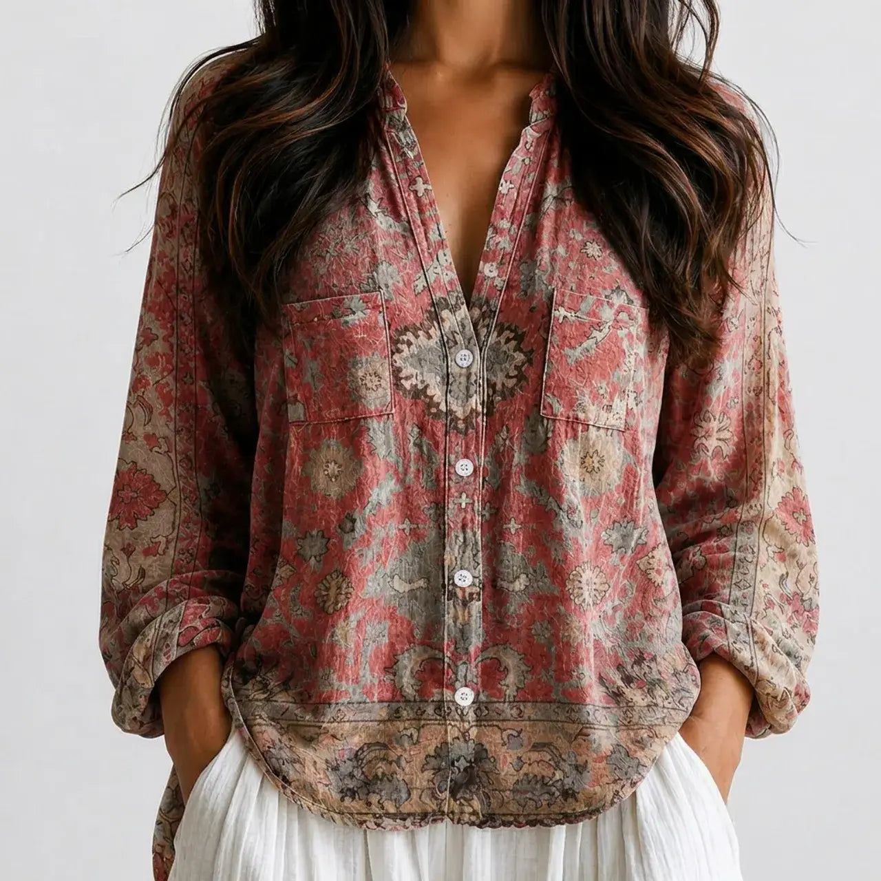 Close-up front view of pink floral boho lightweight blouse with button front and long sleeves BELLA HUDSON.