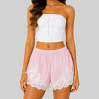 Front view of pink lace trim bloomer shorts with elastic waist and layered ruffle design by BELLA HUDSON