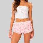 Front view of pink layered ruffle mini shorts with elastic waist by BELLA HUDSON