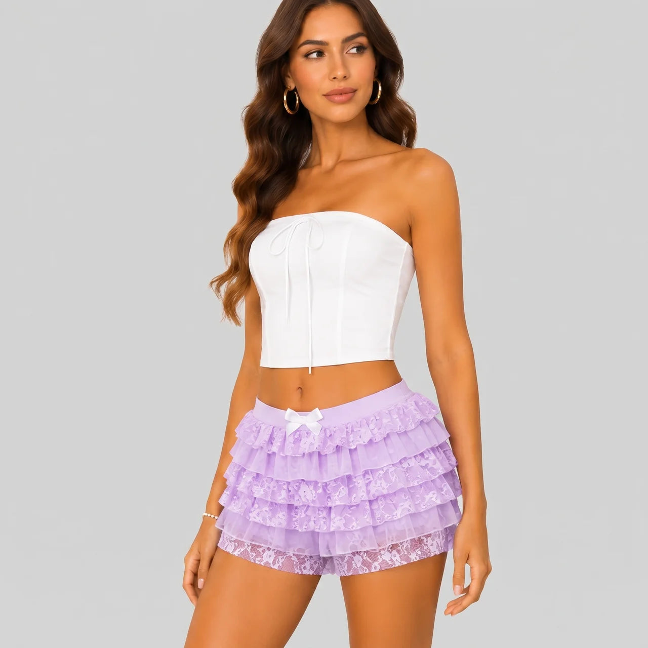 Side view of purple layered ruffle mini shorts with elastic waist by BELLA HUDSON
