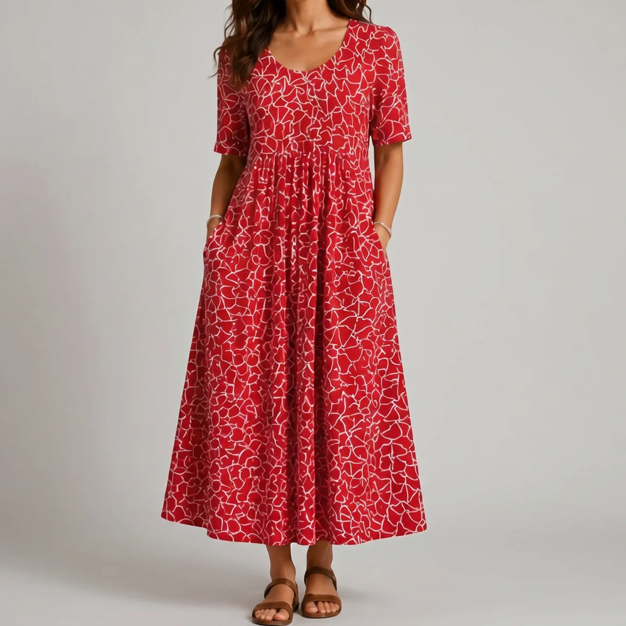Red abstract print maxi dress front view with short sleeves and pockets BELLA HUDSON