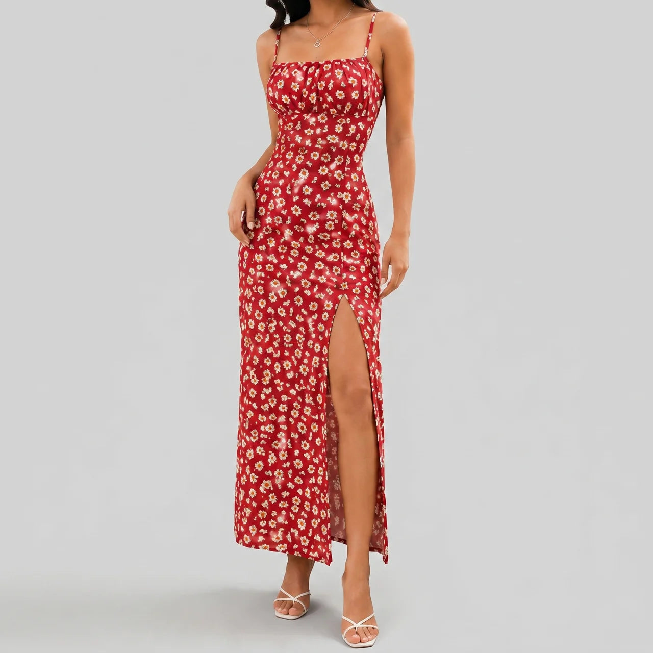 Front view of red floral slit maxi dress with spaghetti straps and fitted silhouette by BELLA HUDSON