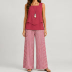 Front view of red layered sleeveless top and wide leg pants set by BELLA HUDSON