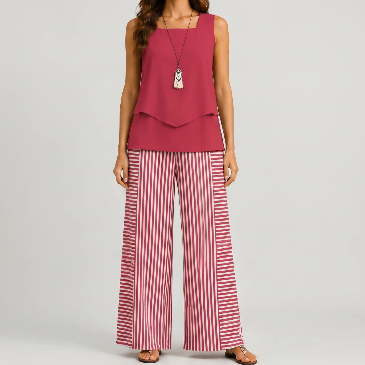 Front view of red layered sleeveless top and wide leg pants set by BELLA HUDSON