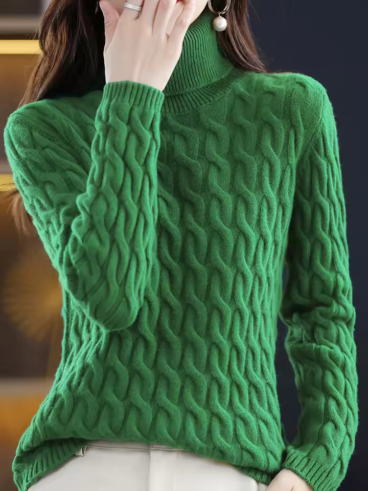 Renee Green cable-knit turtleneck sweater with raised cable pattern, ribbed cuffs, and relaxed fit