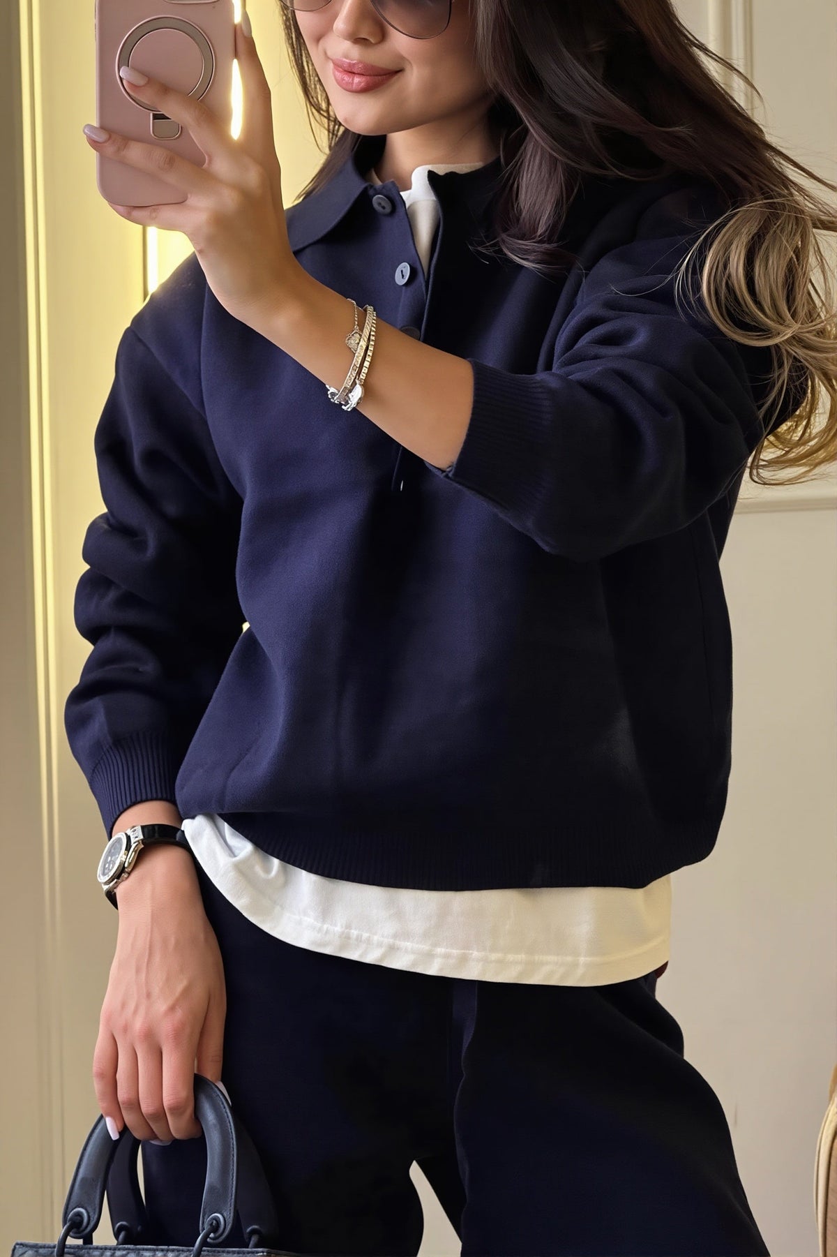 Rhea Navy knit polo lounge set close-up highlighting the polo-style collar, partial button placket, and long sleeves