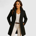 Rheya Black slim-fit longline coat featuring structured lapels, long sleeves, button-front styling, and a tailored silhouette
