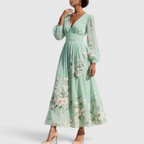 Side view of the Rosalie Midi Dress Floral-Print Chiffon Pleated V-Neck in light green, showcasing the V-neckline, long bishop sleeves, pleated chiffon fabric, and graceful flowing silhouette. Designed by Bella Hudson.
