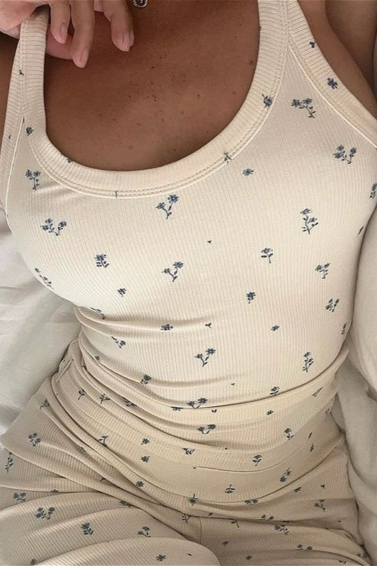 Rosalie White close-up of the rib-knit tank top and pants with a small blue floral print.