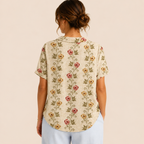 Back view of the Rosalind Blouse Floral-Print Lightweight Collared in beige, showcasing the lightweight fabric, relaxed fit, and back design. Designed by Bella Hudson.