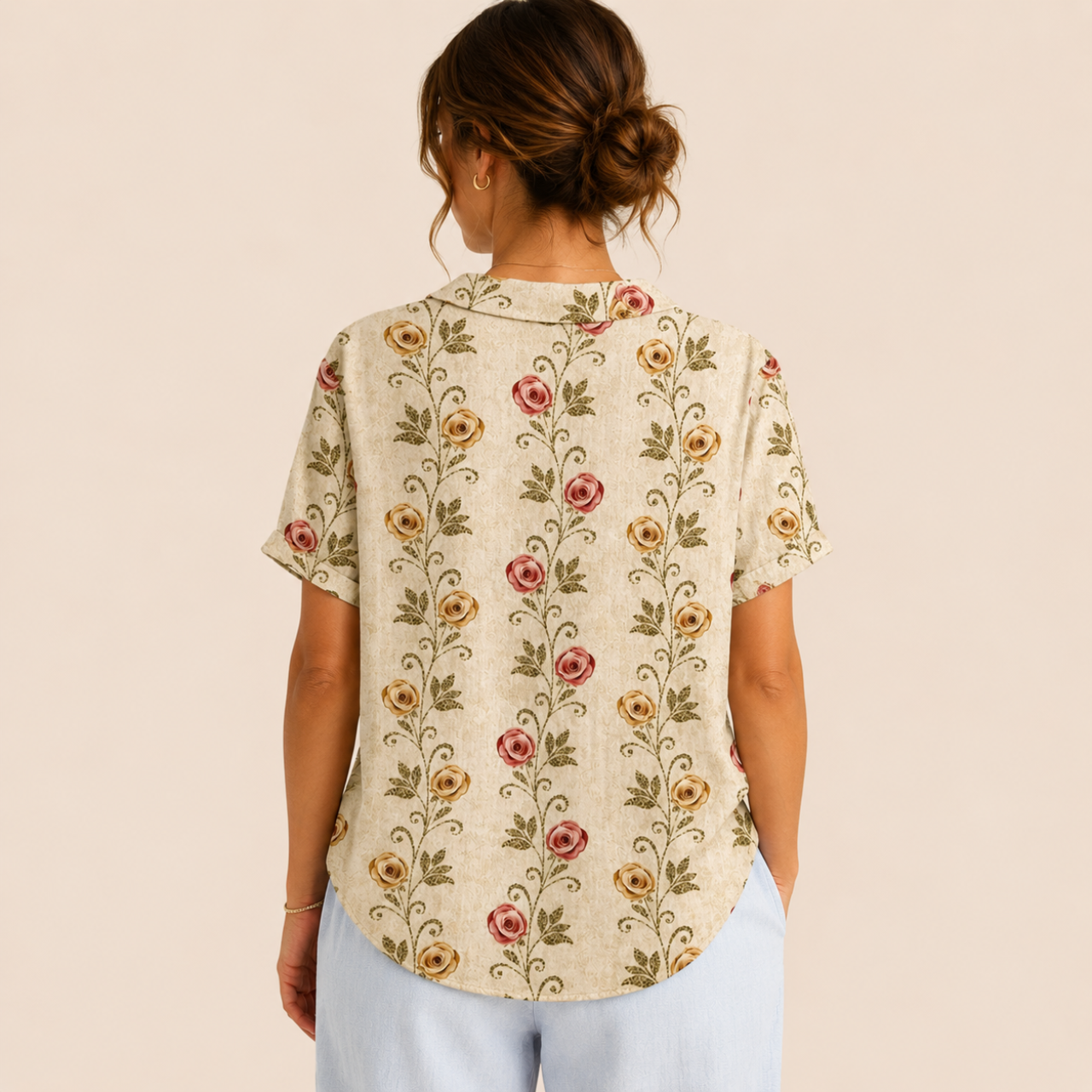 Back view of the Rosalind Blouse Floral-Print Lightweight Collared in beige, showcasing the lightweight fabric, relaxed fit, and back design. Designed by Bella Hudson.