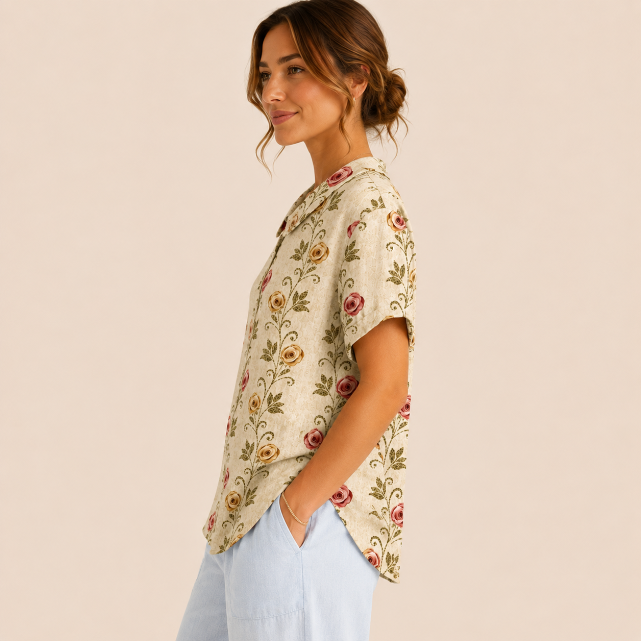 Side view of the Rosalind Blouse Floral-Print Lightweight Collared in beige, showcasing the relaxed silhouette, lightweight fabric, and flattering fit. Designed by Bella Hudson.