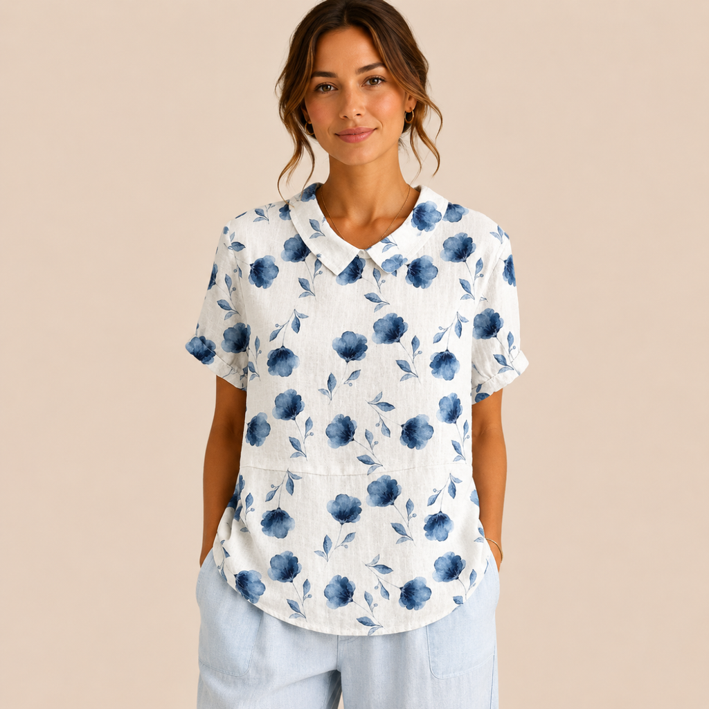 Front view of the Rosalind Blouse Floral-Print Lightweight Collared in blue, featuring a lightweight floral print, collared neckline, and relaxed fit. Designed by Bella Hudson.