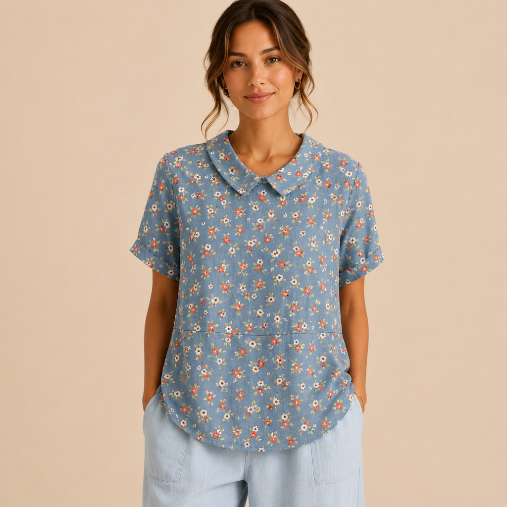 Front view of the Rosalind Blouse Floral-Print Lightweight Collared in blue stripes, featuring a lightweight striped design, collared neckline, and relaxed fit. Designed by Bella Hudson.