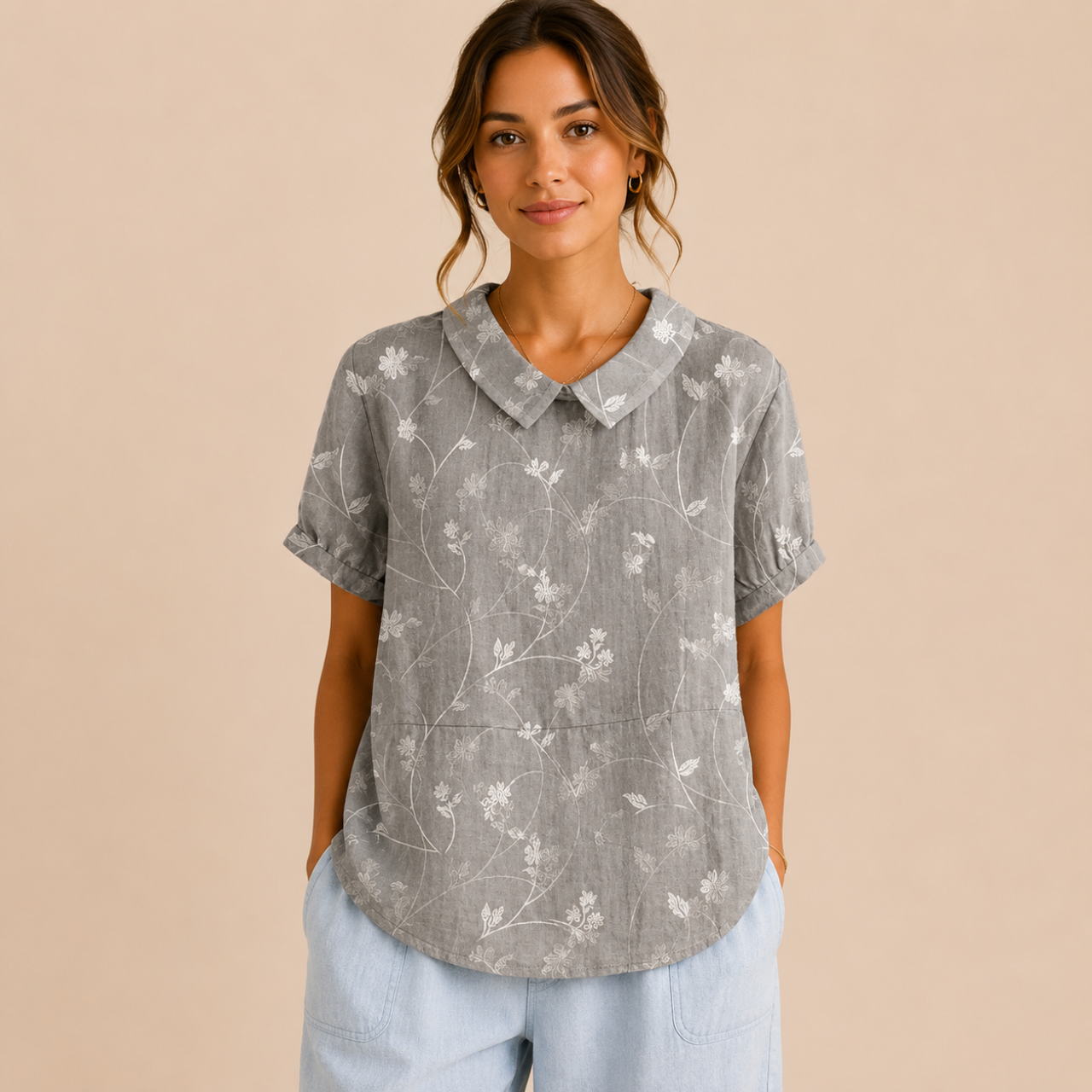 Front view of the Rosalind Blouse Floral-Print Lightweight Collared in gray, featuring a lightweight floral print, collared neckline, and relaxed fit. Designed by Bella Hudson.