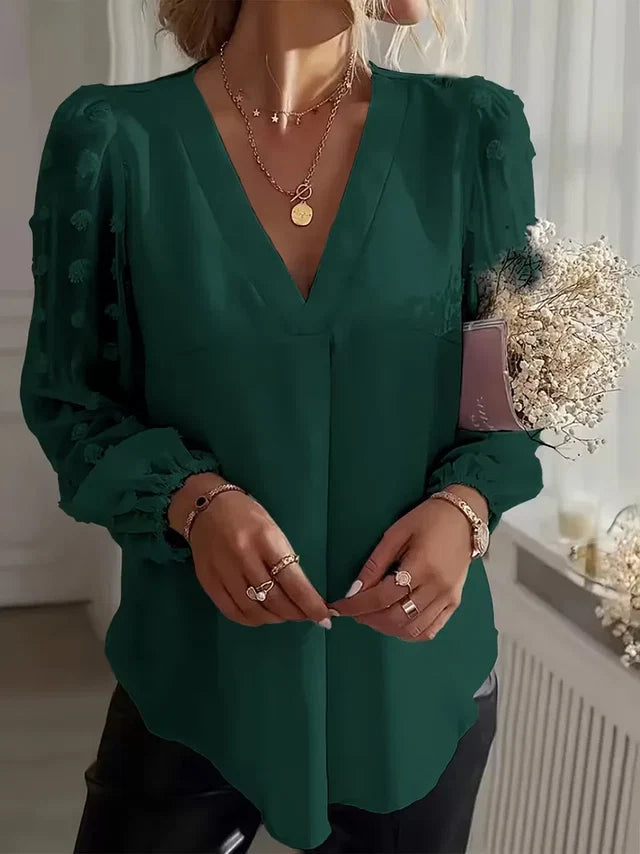 Front view of the Rosalind Blouse Long-Sleeve Sheer-Sleeve Swiss-Dot in green, featuring a V-neckline, sheer Swiss-dot long sleeves, gathered cuffs, and an elegant relaxed silhouette. Designed by Bella Hudson.