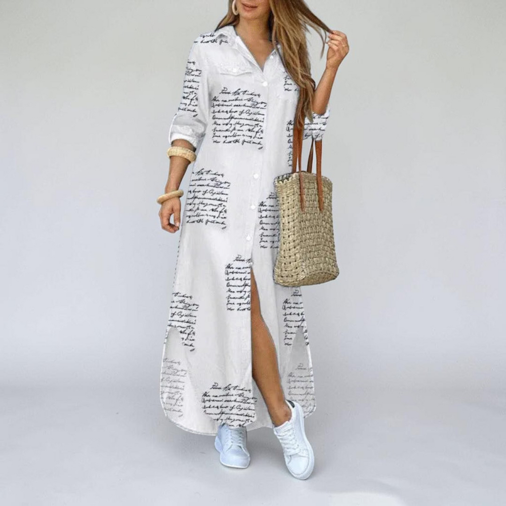 Front view of the Rosamund Shirt Dress Printed Long-Sleeve Button-Front in beige, featuring a collared neckline, button-front closure, printed fabric, side slit, and a relaxed maxi silhouette. Designed by Bella Hudson.