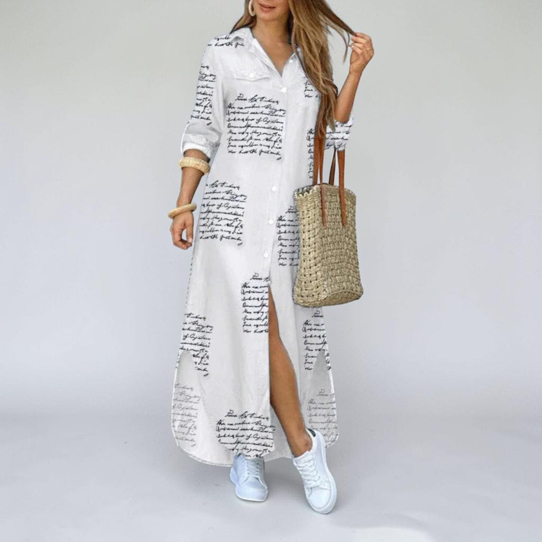 Front view of the Rosamund Shirt Dress Printed Long-Sleeve Button-Front in beige, featuring a collared neckline, button-front closure, printed fabric, side slit, and a relaxed maxi silhouette. Designed by Bella Hudson.