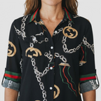 Close-up detail of the Rosamund Shirt Dress Printed Long-Sleeve Button-Front in black, featuring the collared neckline, button-front placket, and intricate chain print. Designed by Bella Hudson.