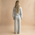 Back view of the Rosamund Two-Piece Set Striped Knit in Light Grey, highlighting the matching silhouette and striped pattern.