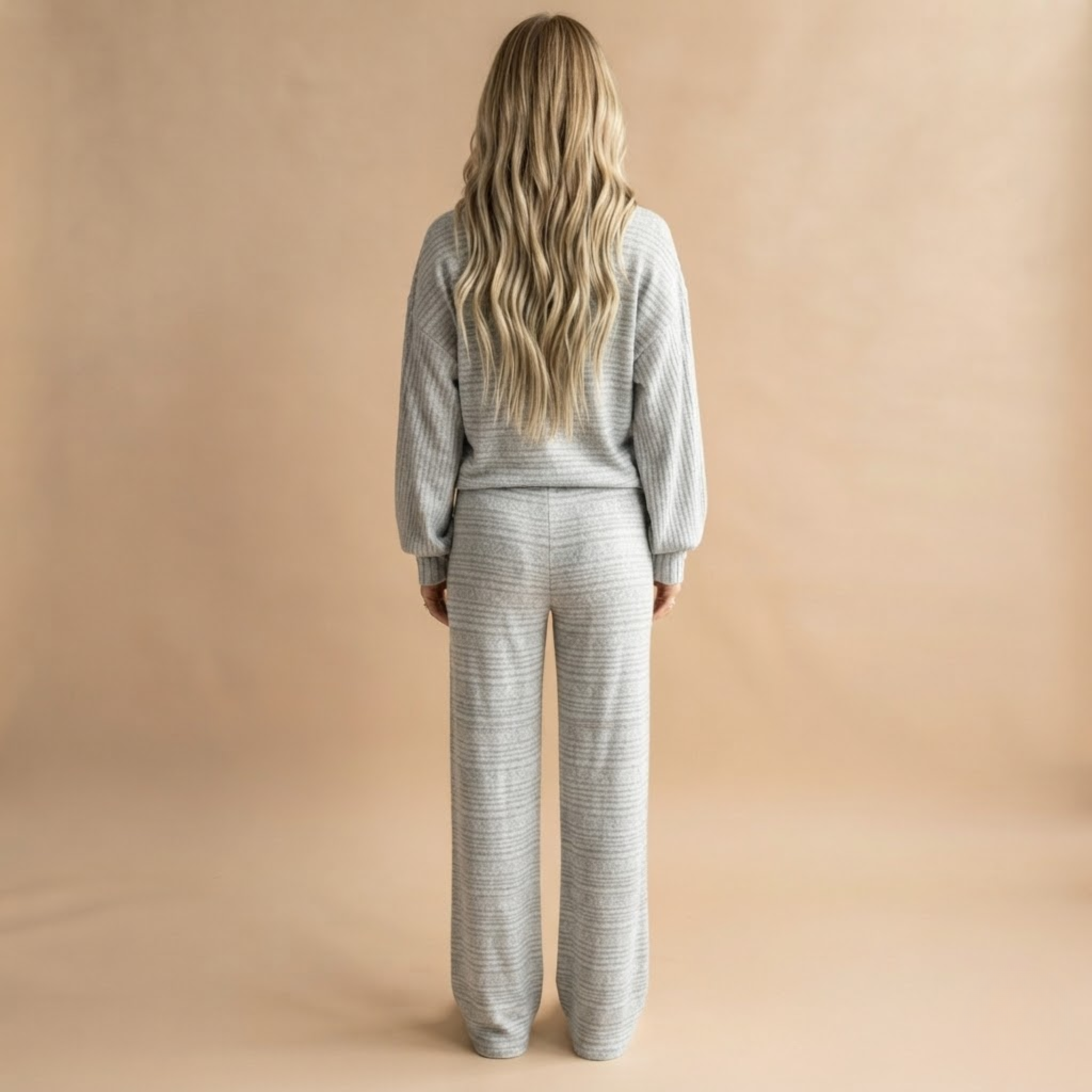 Back view of the Rosamund Two-Piece Set Striped Knit in Light Grey, highlighting the matching silhouette and striped pattern.