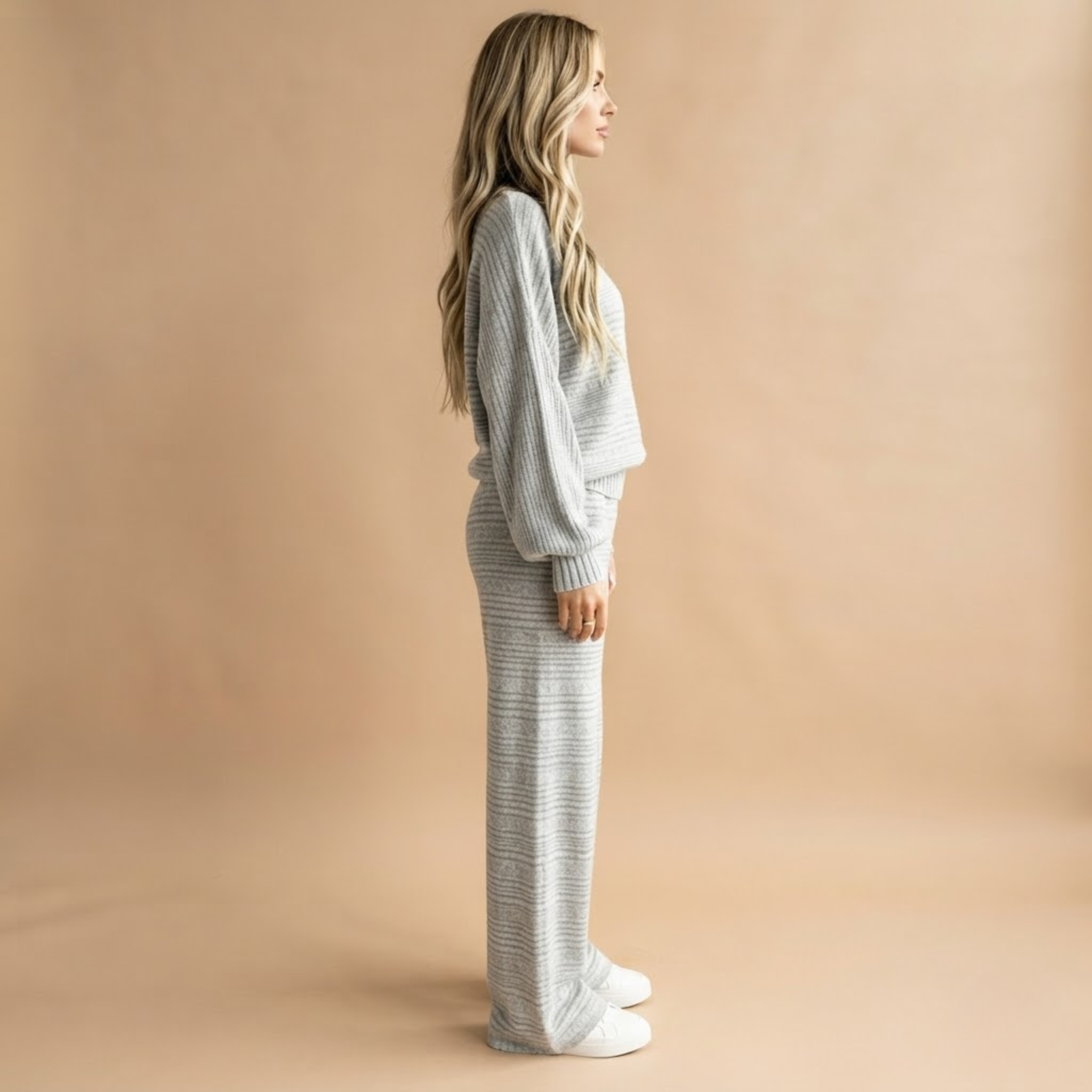 Side view of the Rosamund Two-Piece Set Striped Knit in Light Grey, showcasing its relaxed fit and striped knit design.