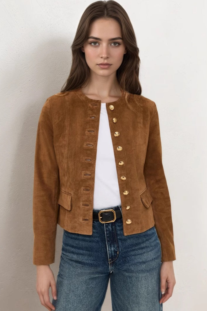 Rosette Brown suede jacket worn open over a white tee and jeans, showing the gold buttons and flap pockets.