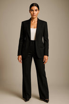 Rowena Black single-breasted blazer and creased wide-leg pants set with pointed black heels.