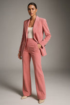 Rowena Pink blazer and wide-leg pants set styled with a white top and nude pointed heels.