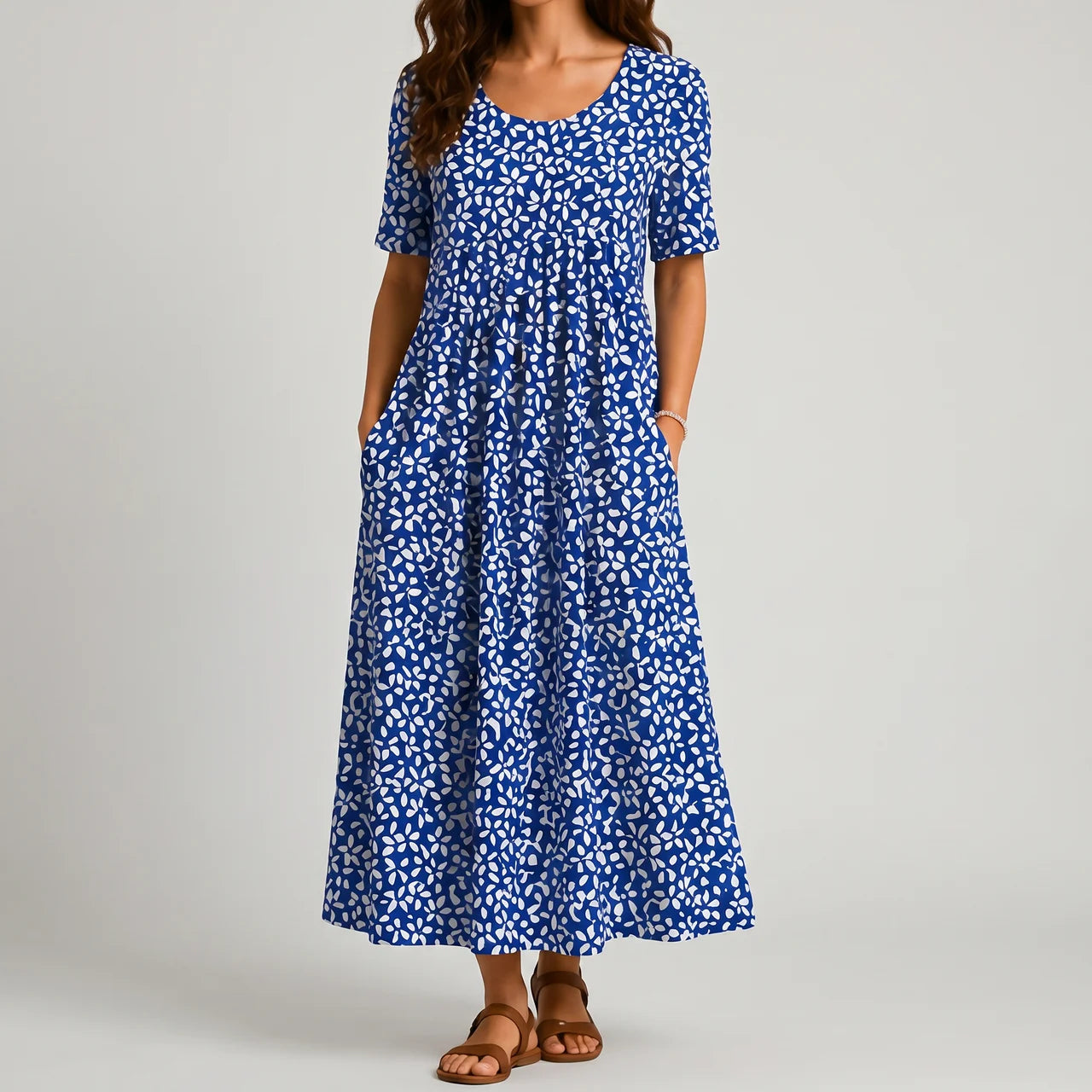 Royal blue leaf print maxi dress front view with short sleeves and pockets BELLA HUDSON