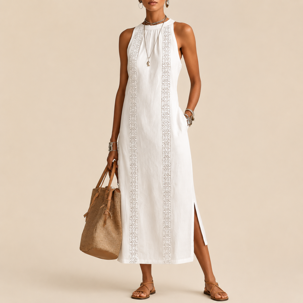 Full model view of the Saffia Lightweight Cotton-Linen Sleeveless Midi Dress in white featuring a sleeveless silhouette, high neckline, decorative lace panel detailing, side pockets, and relaxed midi-length design. Designed by Bella Hudson.