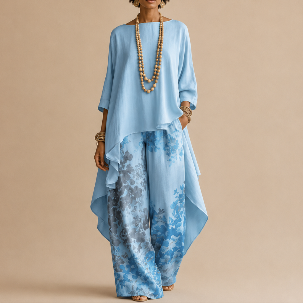 Saffron Boho Two-Piece Set Draped Floral-Print in blue front view with a flowing asymmetrical top and floral-print wide-leg pants, designed by Bella Hudson.