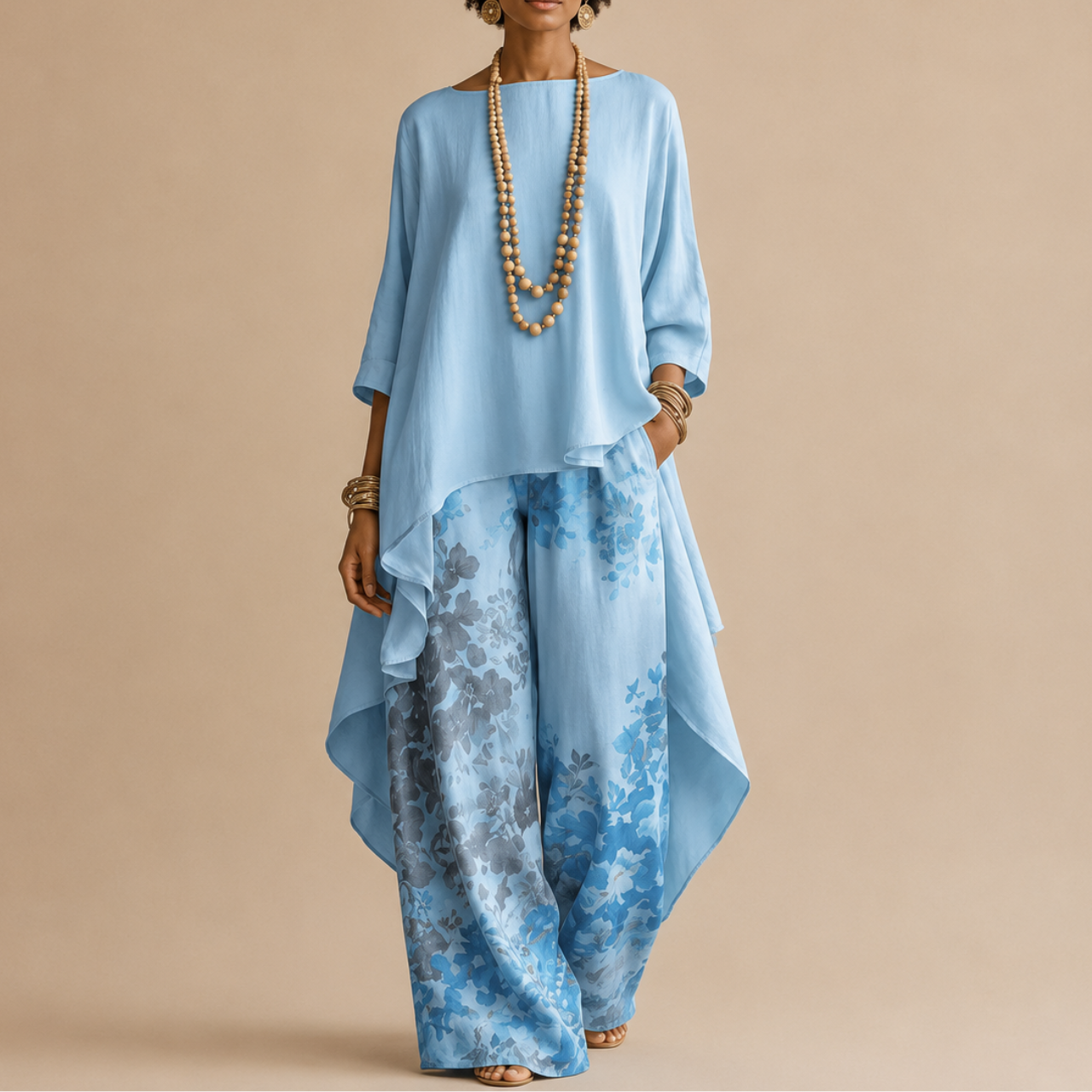 Saffron Boho Two-Piece Set Draped Floral-Print in blue front view with a flowing asymmetrical top and floral-print wide-leg pants, designed by Bella Hudson.