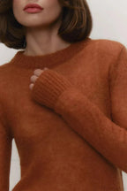 Selena Brown crewneck sweater close-up of the ribbed neckline, ribbed cuff, and soft knit texture.