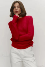 Selena Red sheer-knit crewneck sweater with long sleeves, styled with white pants in a front view.