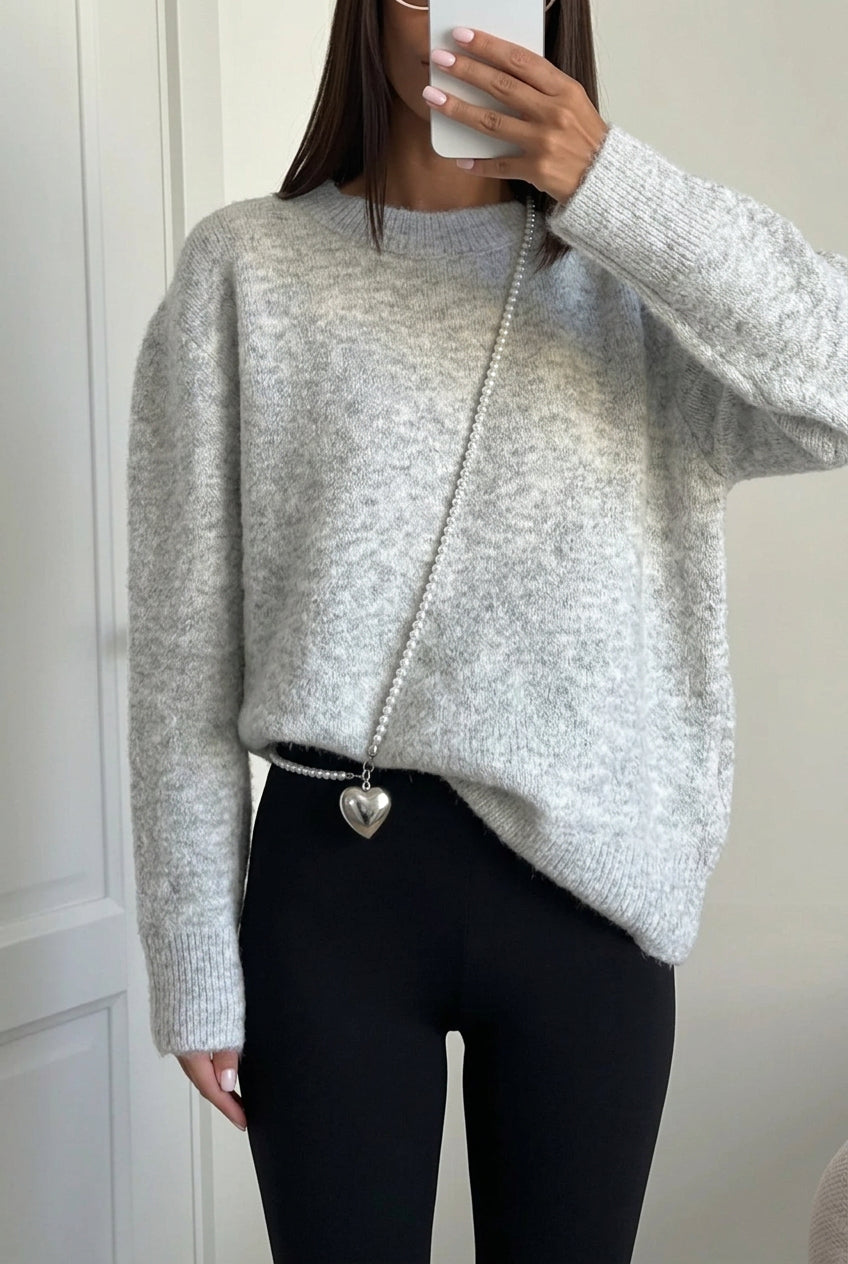 Sienna Gray fuzzy crew-neck sweater styled with black leggings and a pearl-chain bag.