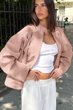 Sienna Pink faux suede bomber jacket shown from the front with a relaxed silhouette and stand collar