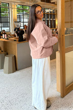 Sienna Pink faux suede bomber jacket styled in a full-body view with a relaxed fit and regular-length cut