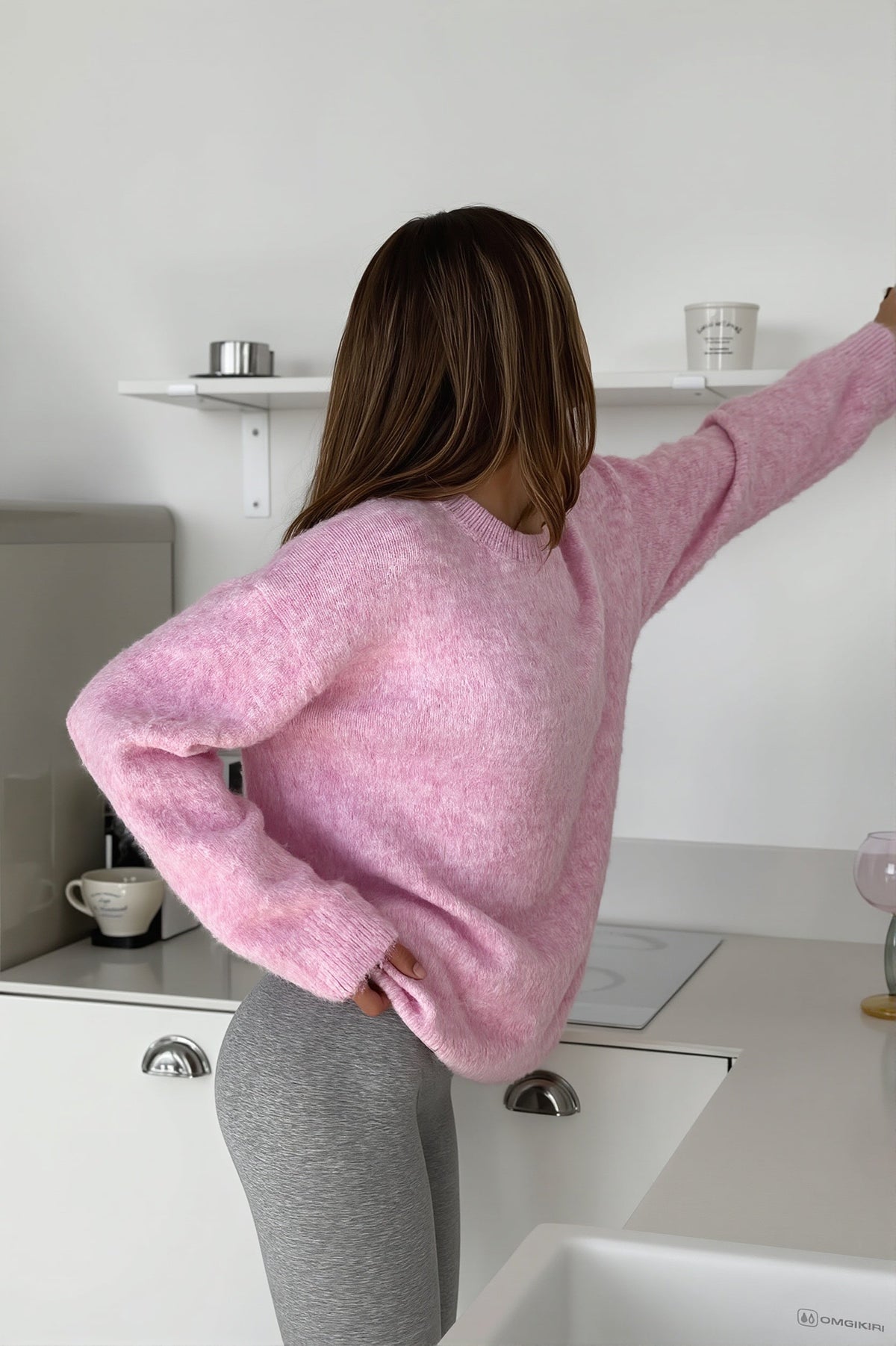 Sienna Pink sweater seen from the back and side, showing the relaxed oversized fit and long sleeves.