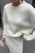 Sienna White sweater close-up showing the soft fuzzy texture and ribbed crew neckline.