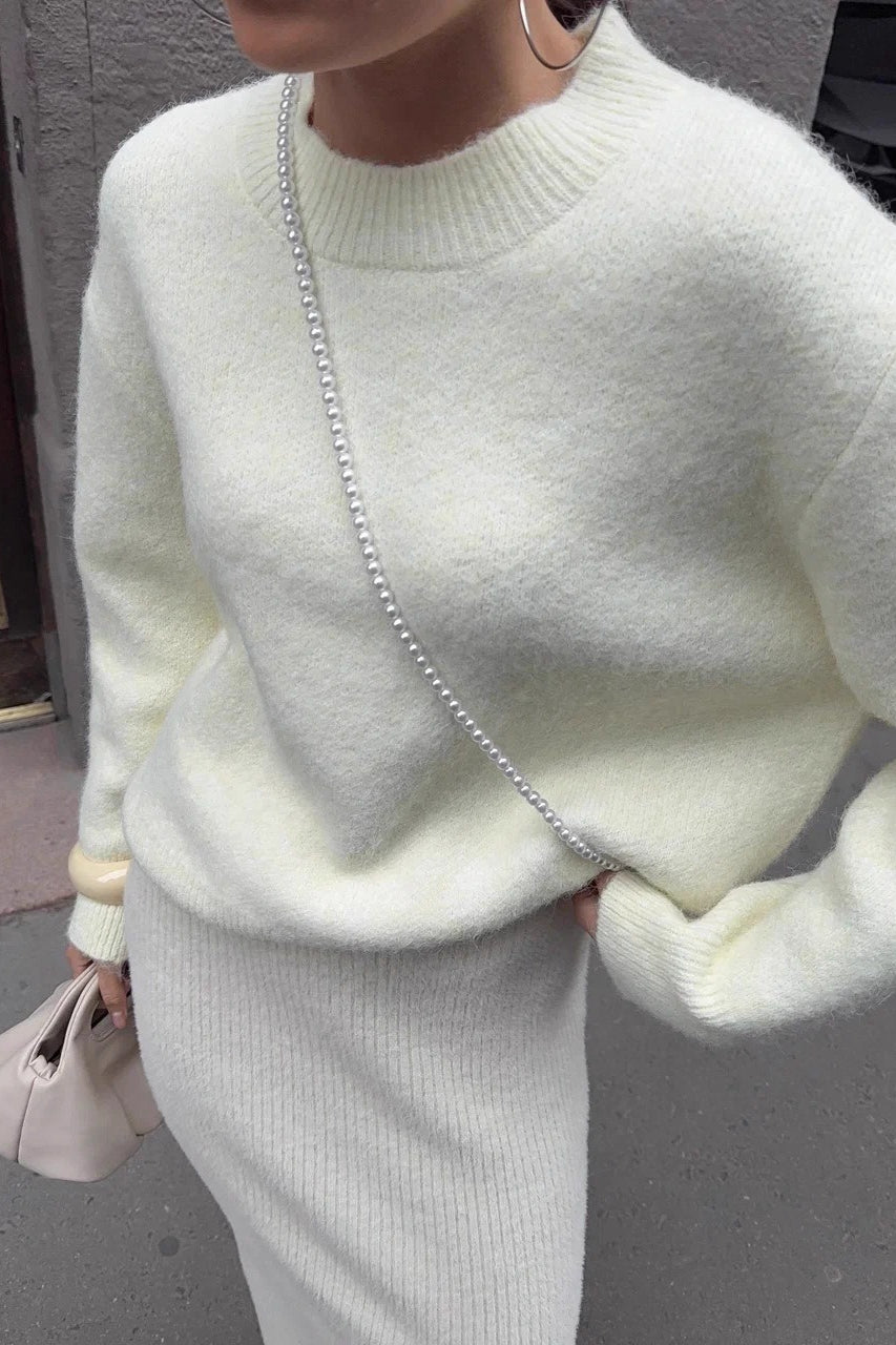 Sienna White sweater close-up showing the soft fuzzy texture and ribbed crew neckline.